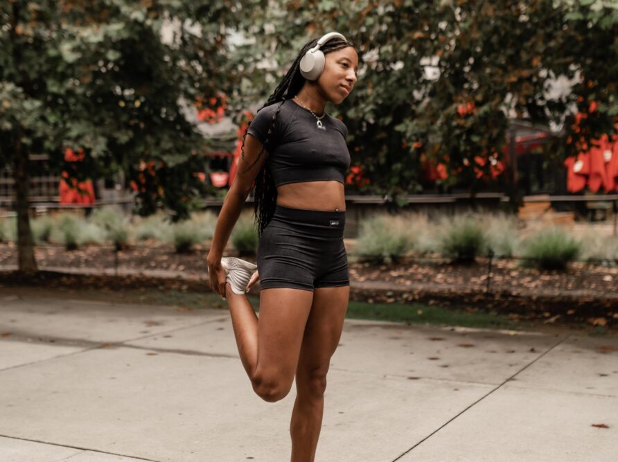 girl stretching before a run in midtown atlanta