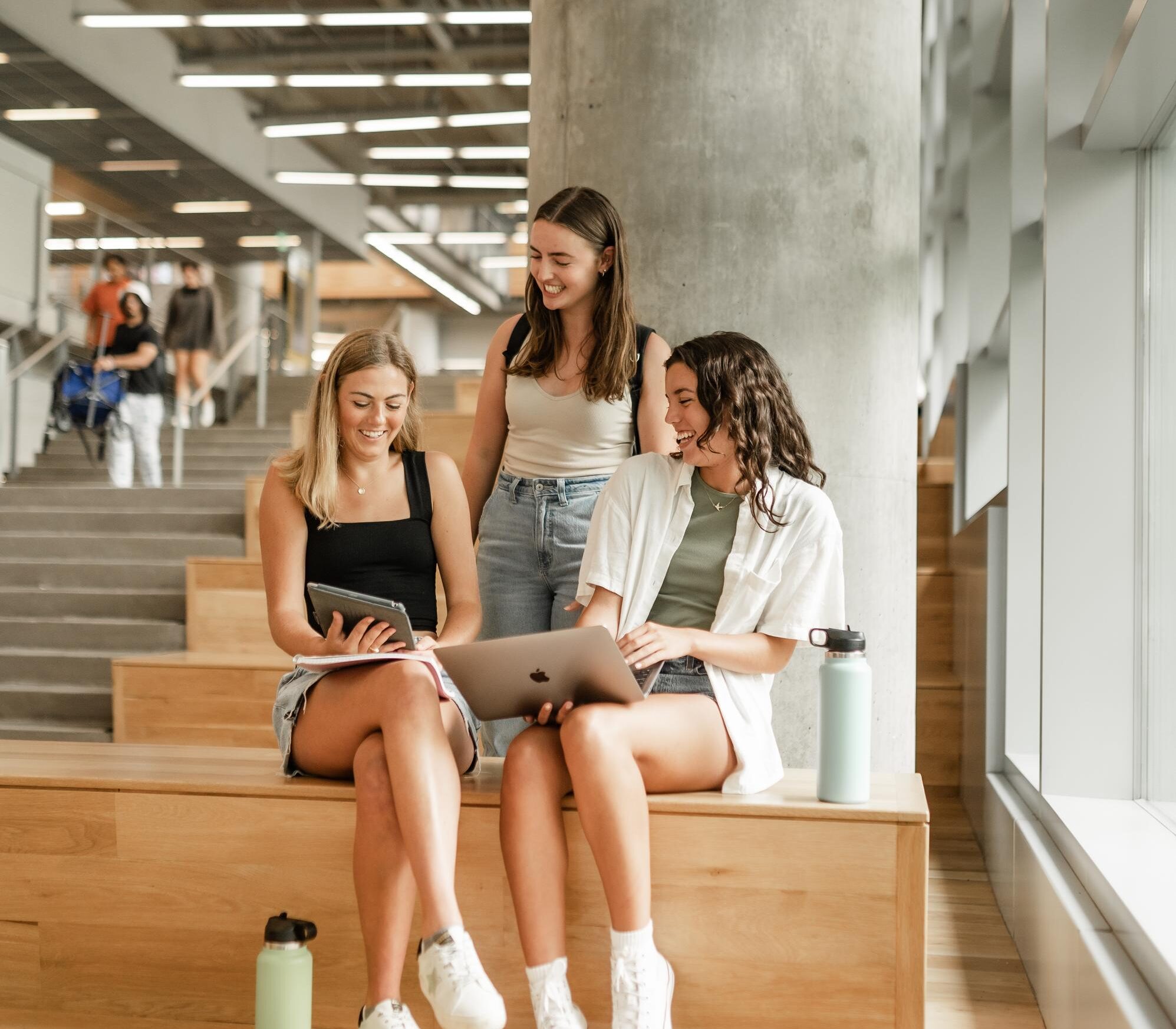 Three girls looking at laptop