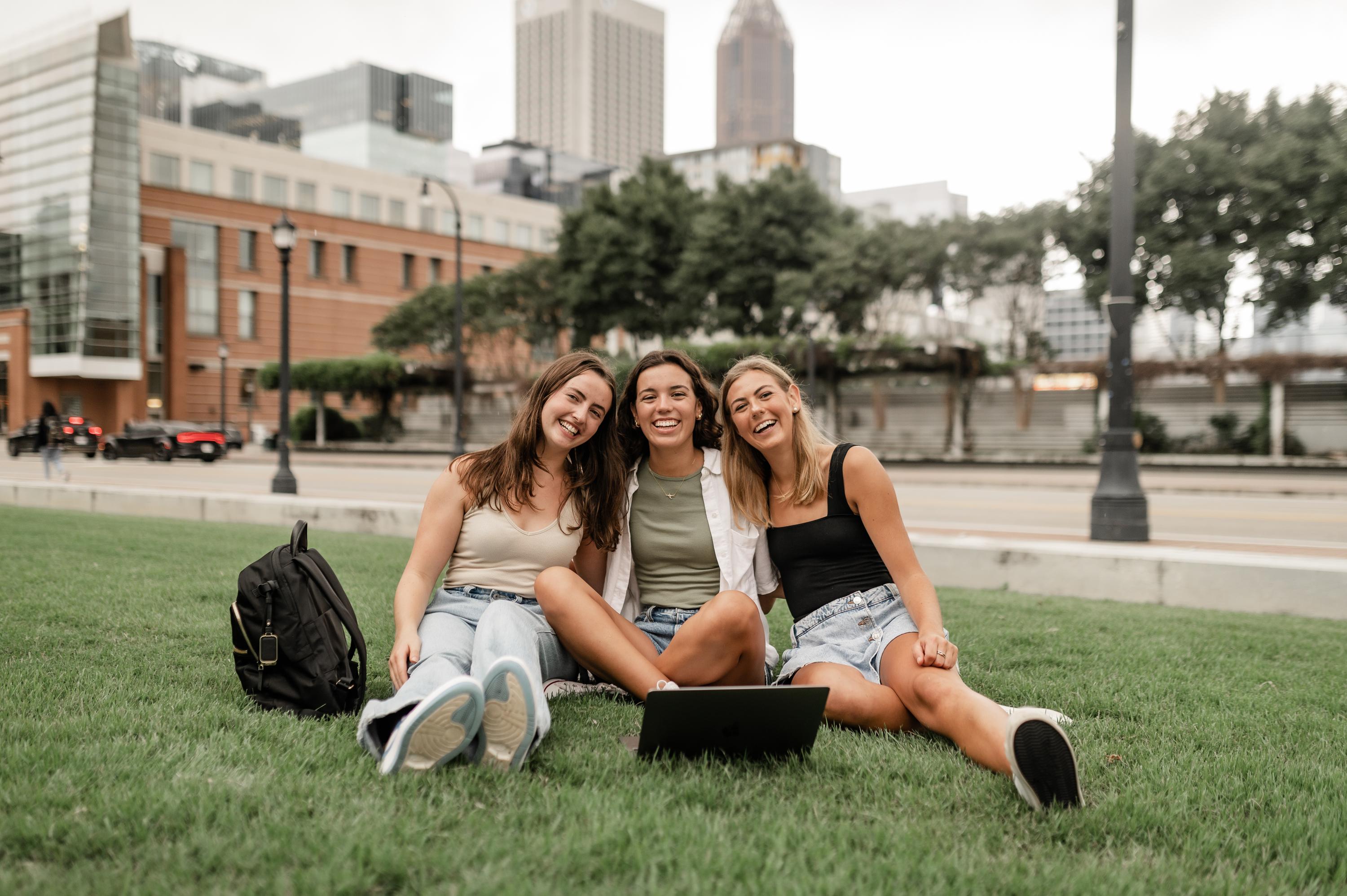 Three girls in Atlanta with a laptop