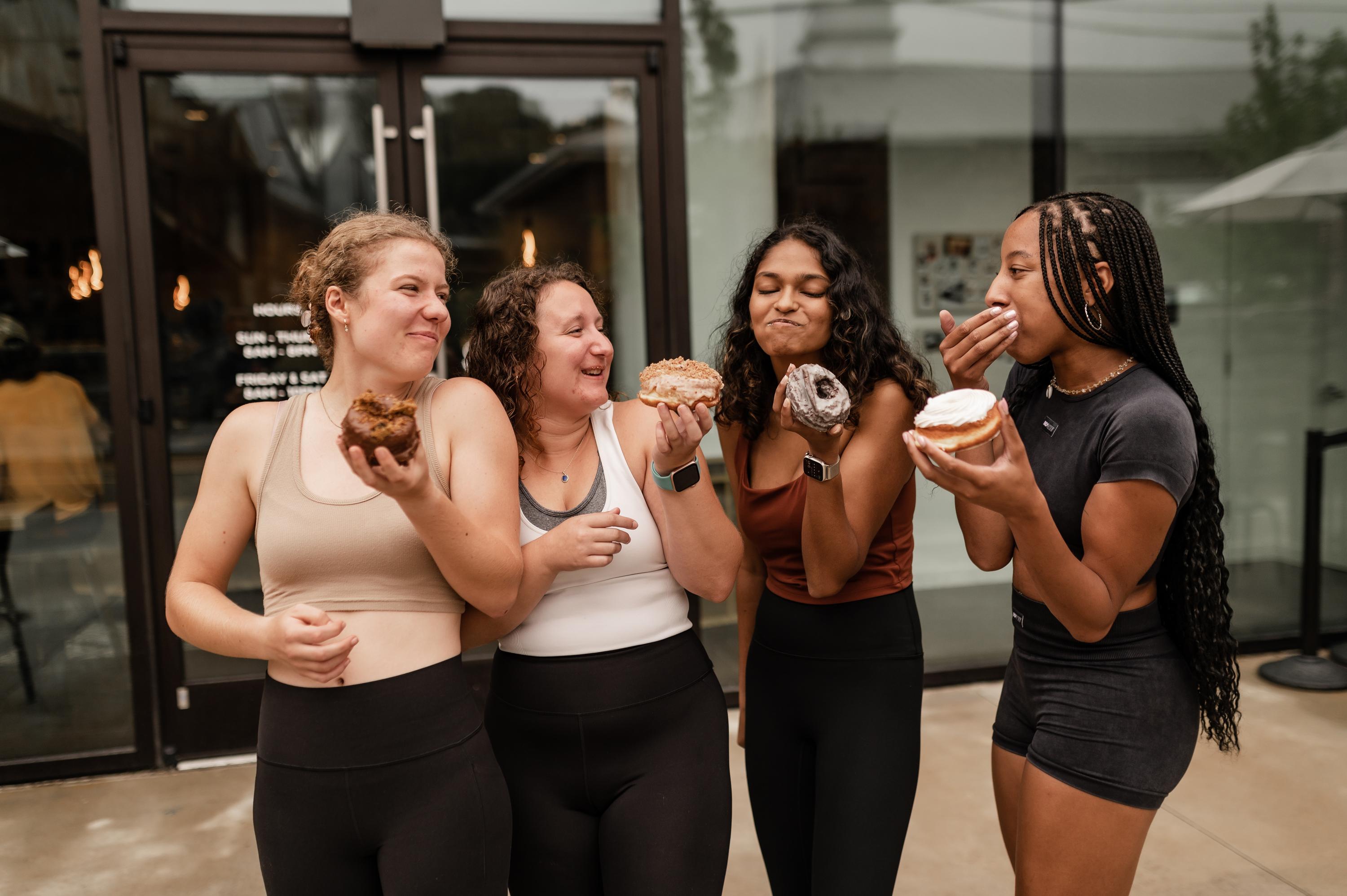 Girls eating donuts in Atlanta