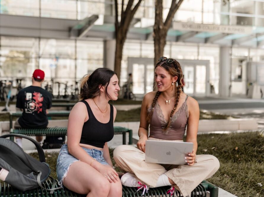two girls talking over homework on campus at georgia tech near rambler atlanta