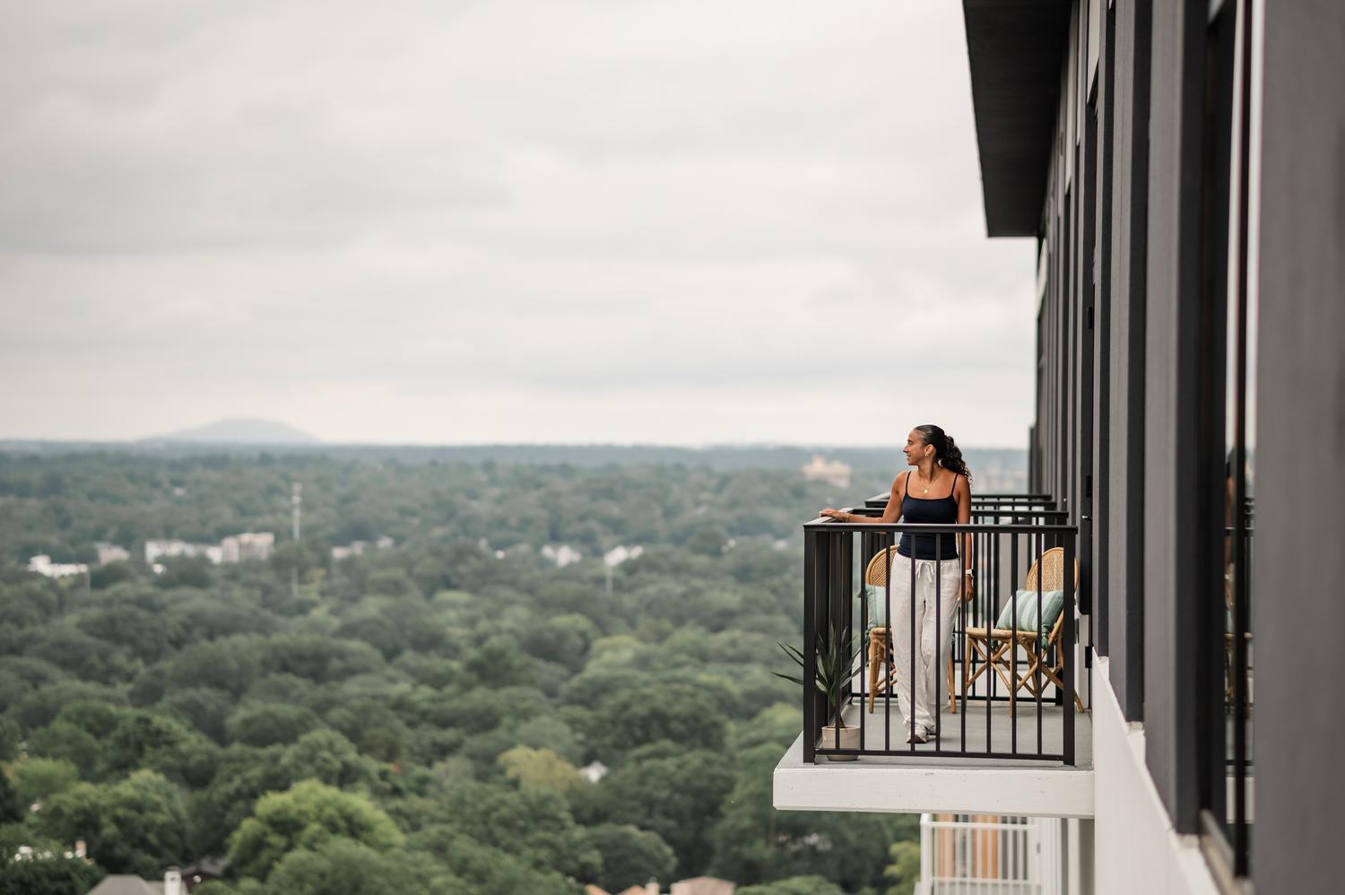 Woman looking off balcony at Rambler Atlanta