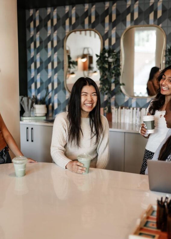 Women talking at table in Rambler Atlanta